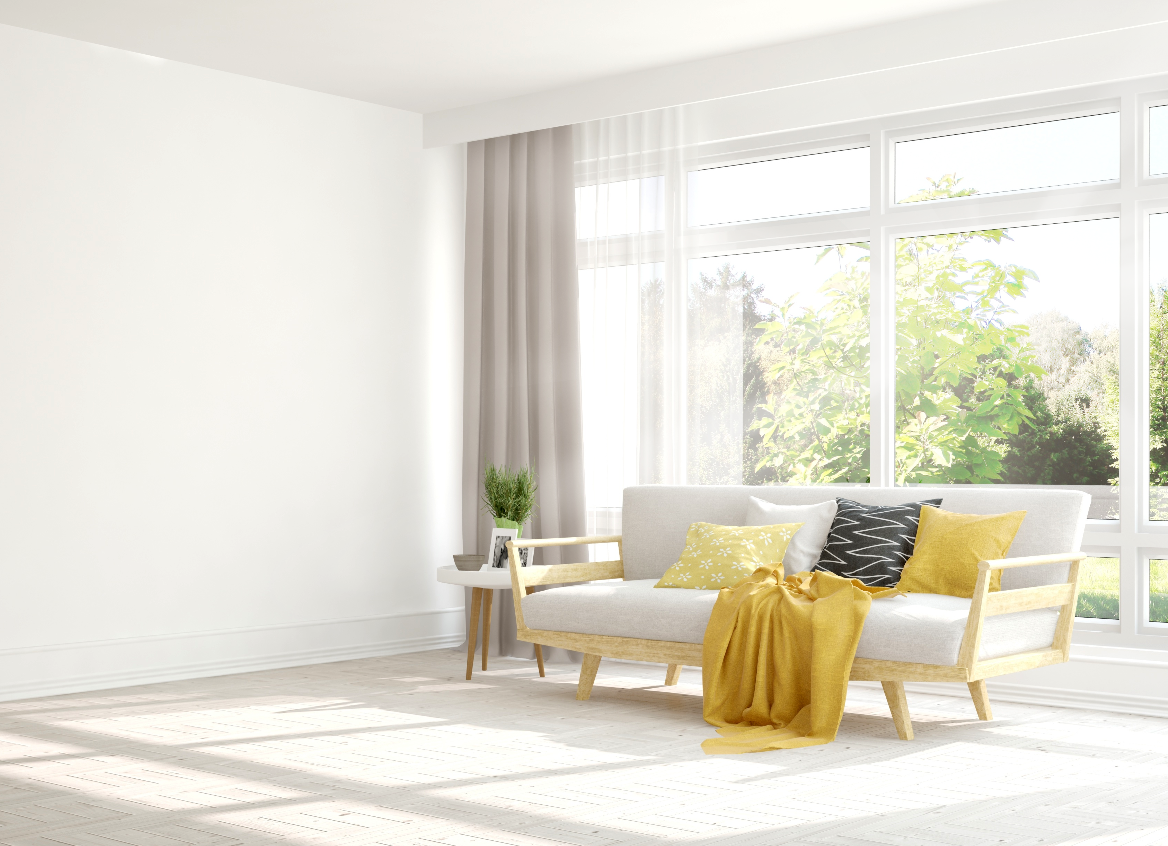 Imagen de una sala muy bien iluminada con unas ventanas en el fondo